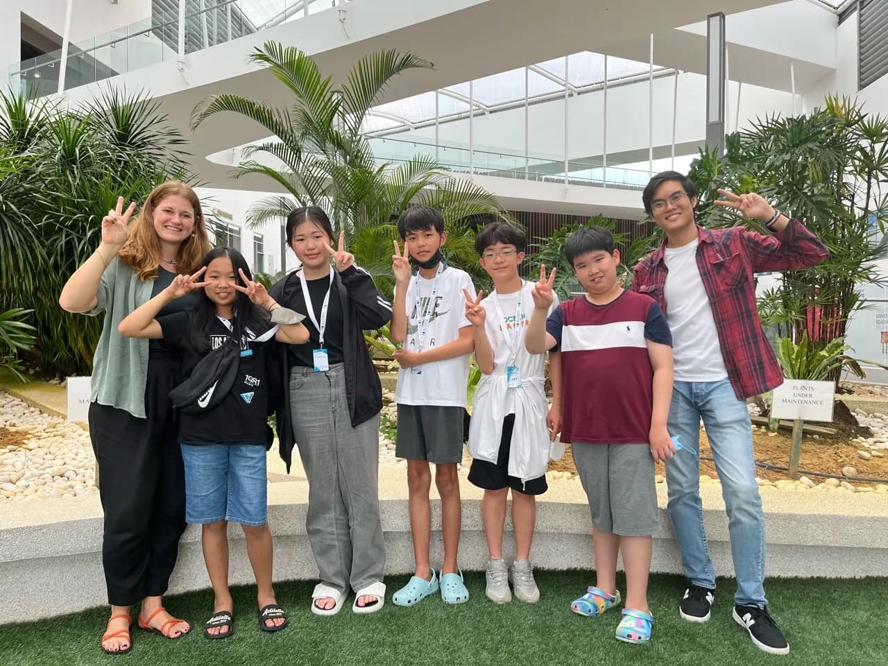 Campers with native and local teachers in the atrium