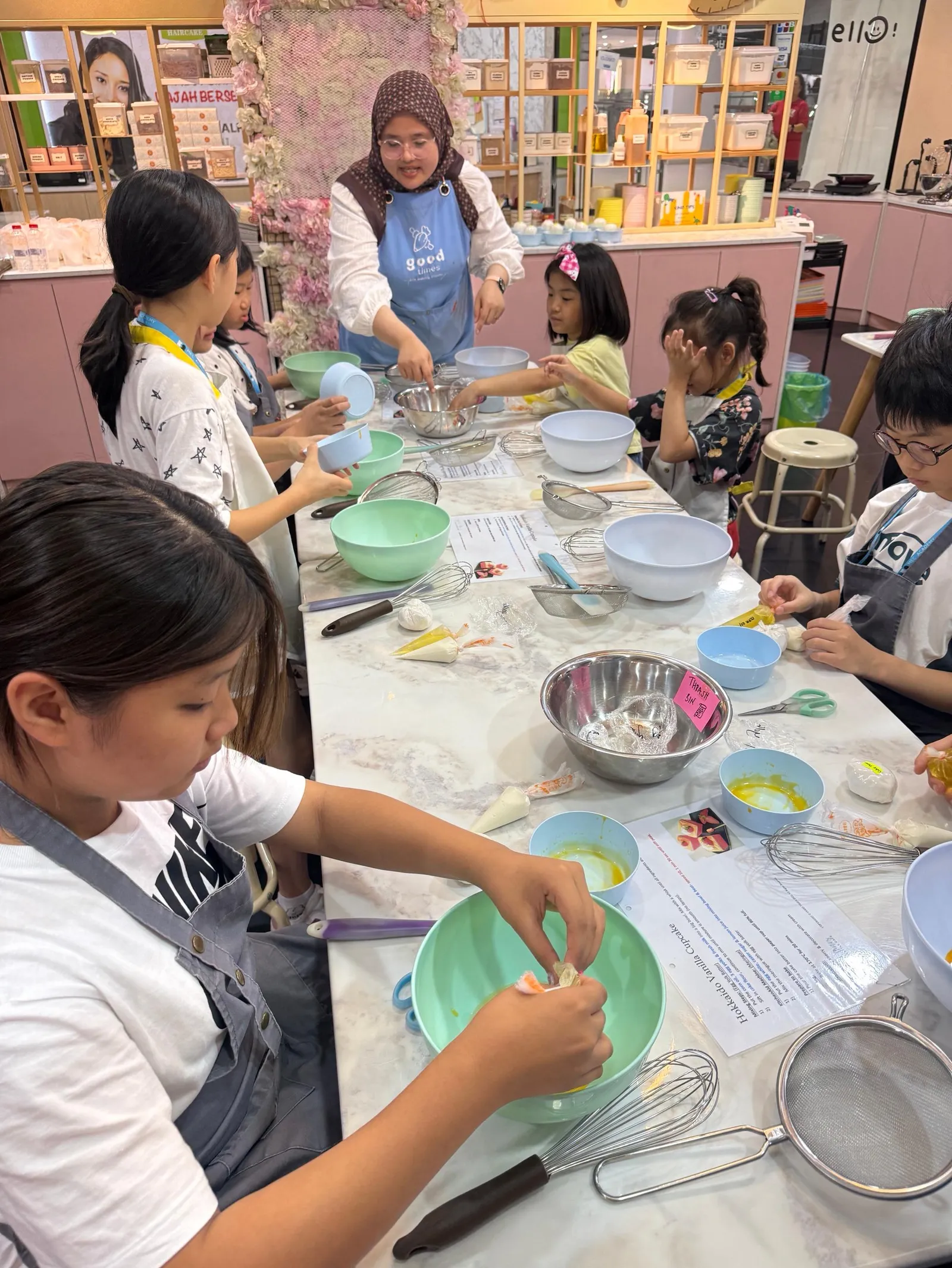 Children baking in an English activity
